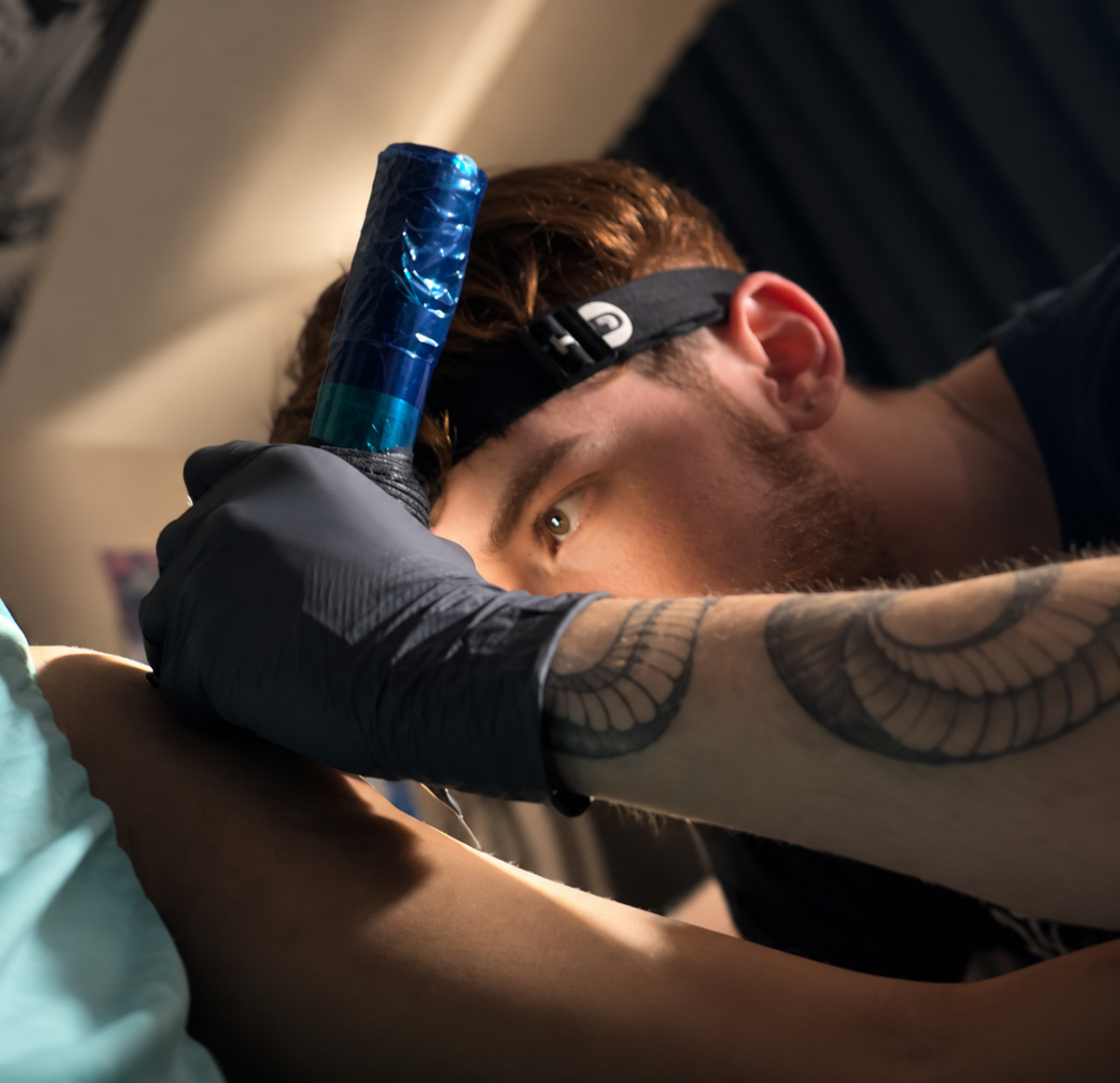 Tattoo artist Caymus Kochis